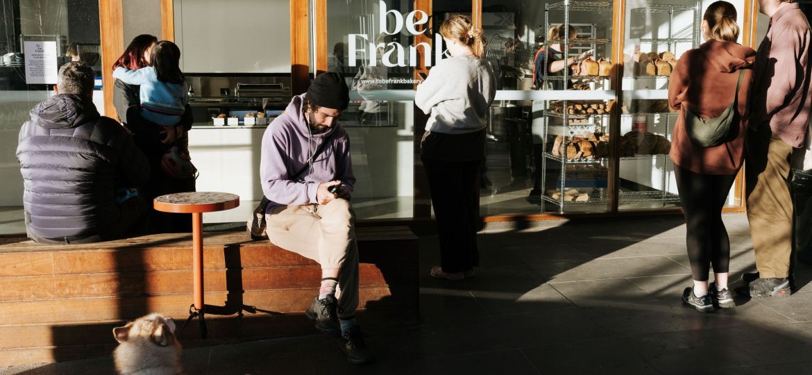 people sitting outside to be frank bakery